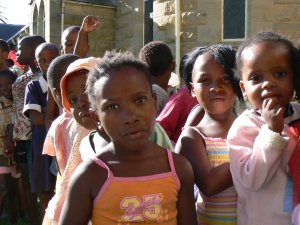 The line lengthens before the children are fed dinner at the Maseru United Church soup kitchen.